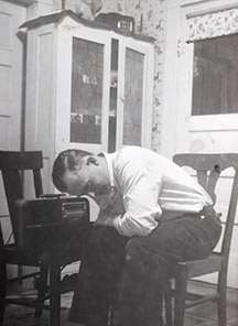 Mills listening to reports of the attack on Pearl Harbor.